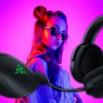 girl on purple backgroun with Razer headphones