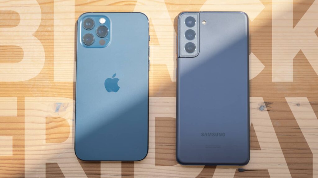 galaxy s21 and iphone 13 pro max on wood table