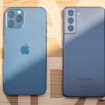galaxy s21 and iphone 13 pro max on wood table