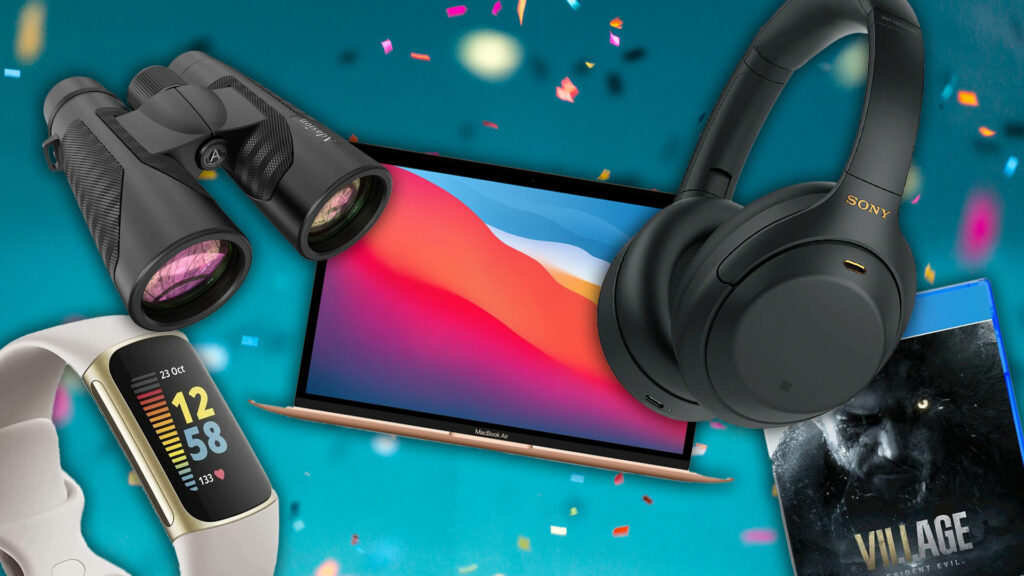 headphones, fitness watches and laptop on starry background