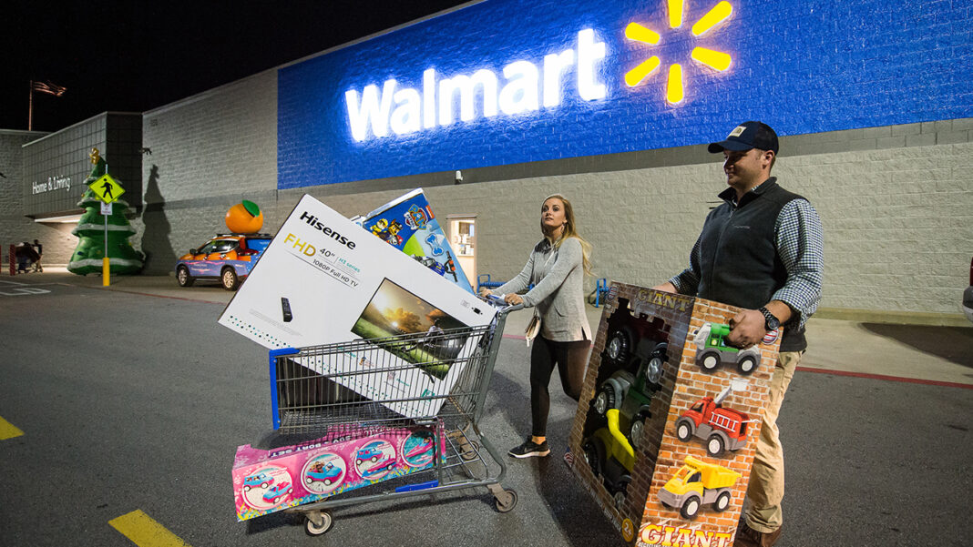 Walmart Black Friday shopper with cart full of goods.